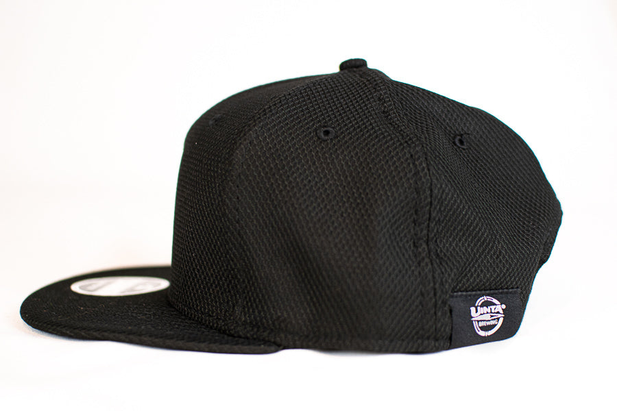 side view baseball hat with logo tag